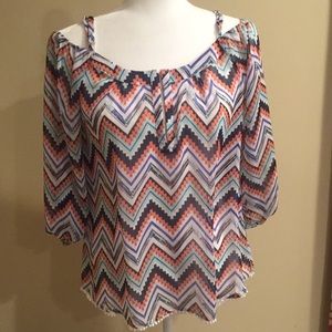 Beautiful off the shoulder sheath blouse .
